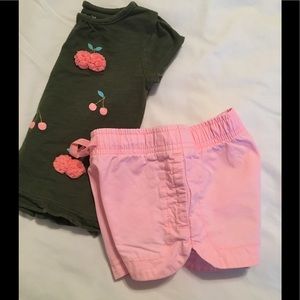 Army green shirt and pink shorts